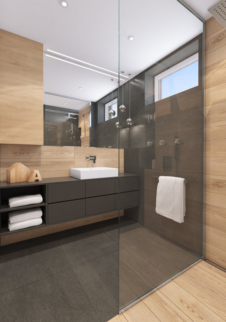 Návrh interiéru bytu pro mladého muže. V interiéru převládá kombinace antracitové barvy s bílou, světlým dřevodekorem a šedou. Doplňkou barvou je tmavě modrá,…