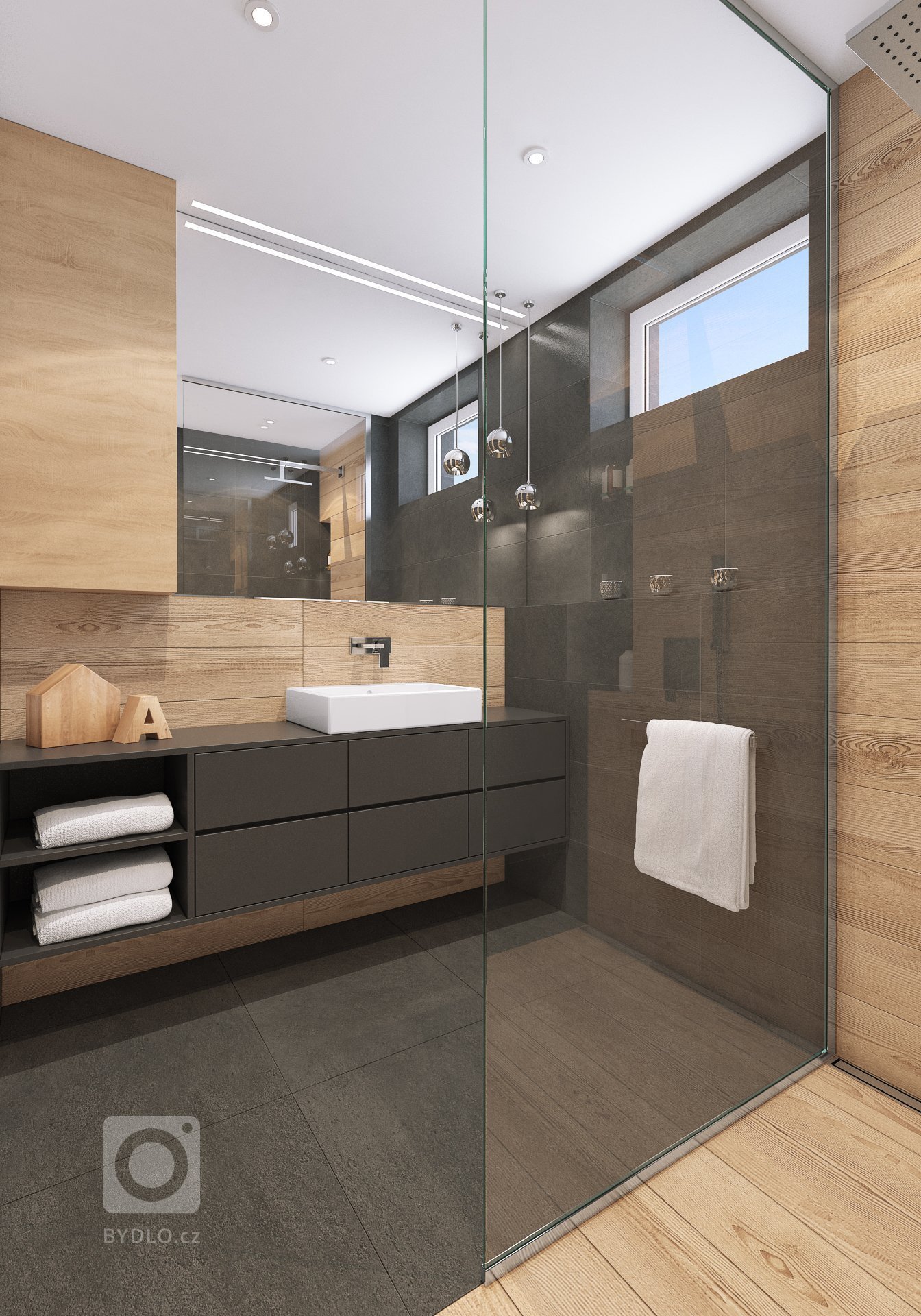 Návrh interiéru bytu pro mladého muže. V interiéru převládá kombinace antracitové barvy s bílou, světlým dřevodekorem a šedou. Doplňkou barvou je tmavě modrá,…