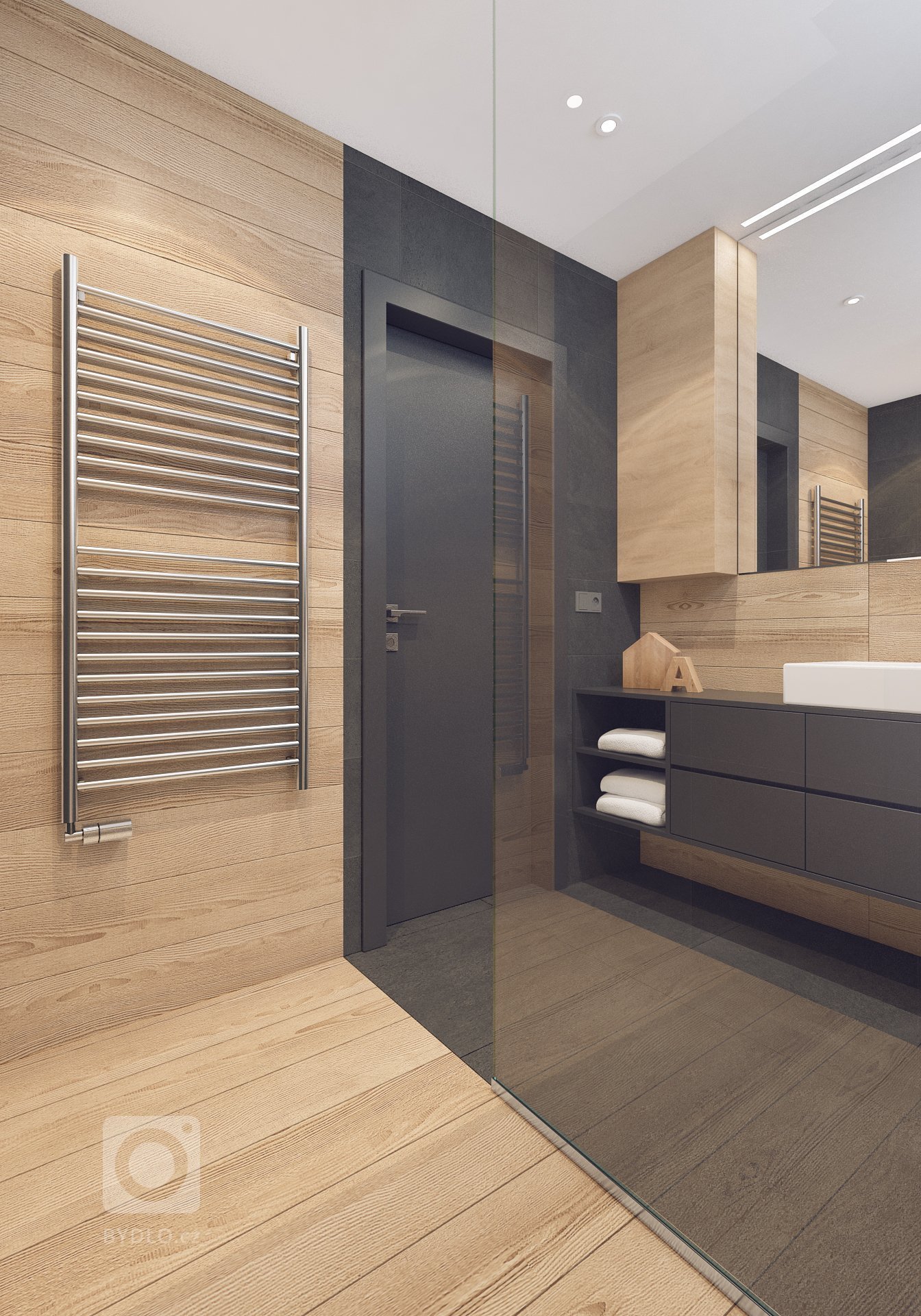 Návrh interiéru bytu pro mladého muže. V interiéru převládá kombinace antracitové barvy s bílou, světlým dřevodekorem a šedou. Doplňkou barvou je tmavě modrá,…